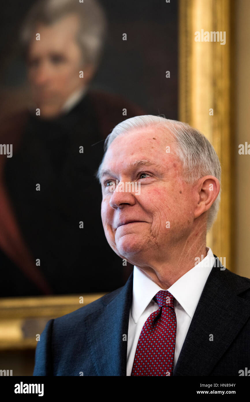 Attorney General Jeff Sessions listens to U.S. President Donald J. Trump speak before Vice President Mike Pence swore Sessions in as the next attorney general in the Oval Office of the White House in Washington, DC, USA, 09 February 2017. On 08 February, after a contentious battle on party lines, the Senate voted to confirm Sessions as attorney general. Credit: Jim LoScalzo/Pool via CNP /MediaPunch Stock Photo