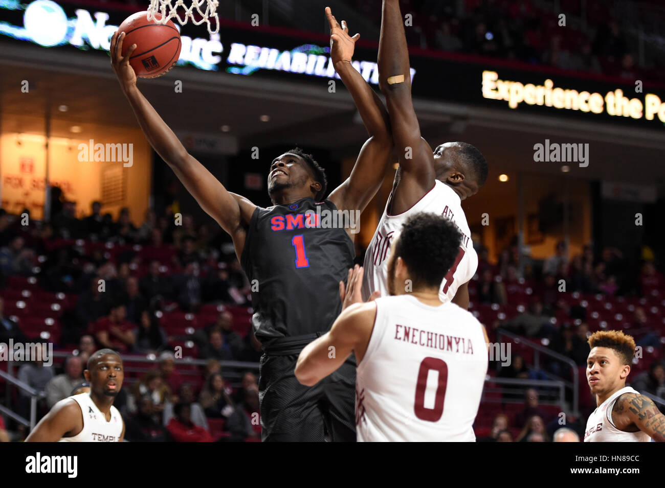 Philadelphia, Pennsylvania, USA. 9th Feb, 2017. Southern Methodist Mustangs guard SHAKE MILTON (1) puts up a shot as Temple Owls center ERNEST AFLAKPUI (24) goes for a block during the American Athletic Conference basketball game being played at the Liacouras Center in Philadelphia. SMU beat Temple 66-50. Credit: Ken Inness/ZUMA Wire/Alamy Live News Stock Photo