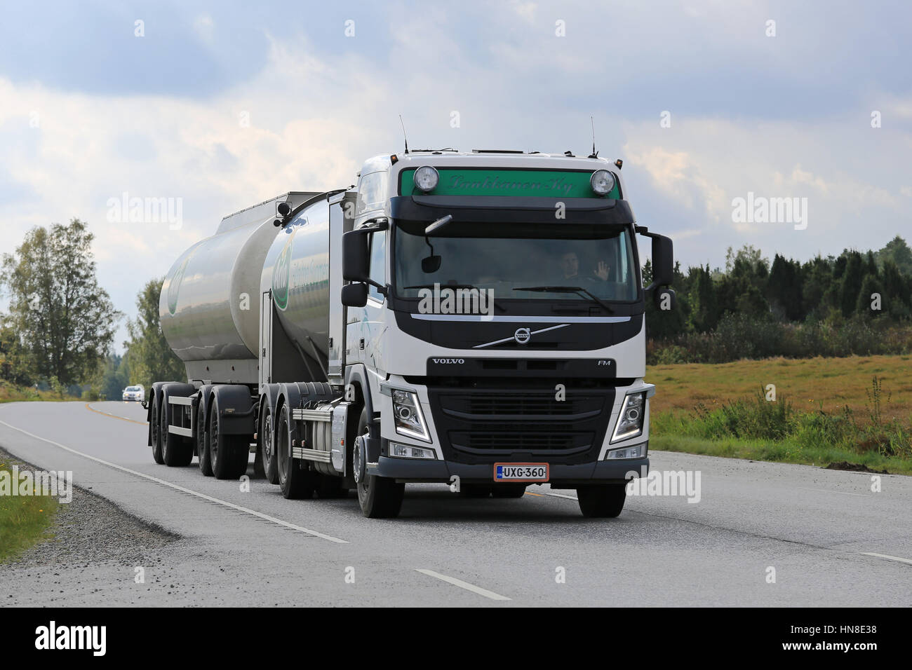 PADASJOKI, FINLAND - SEPTEMBER 1, 2016: Volvo FM milk truck moves along rural highway to collect milk from farms in the area. Stock Photo