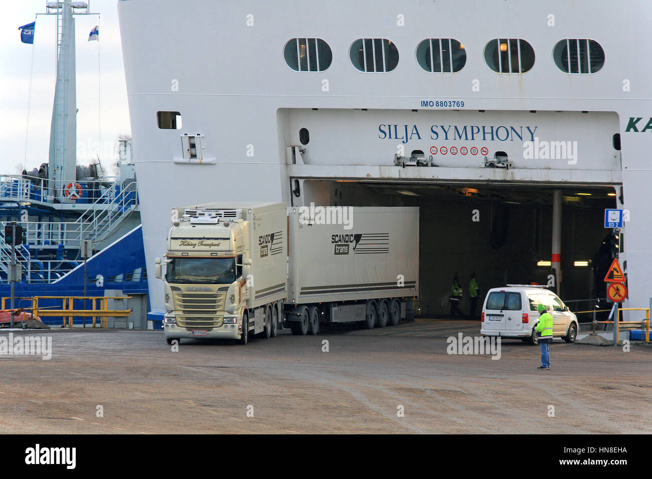 HELSINKI, FINLAND - JANUARY 25, 2017: Scania truck and refrigerator trailers of Helsing Transport drives out of Silja Symphony ferry at Helsinki South Stock Photo