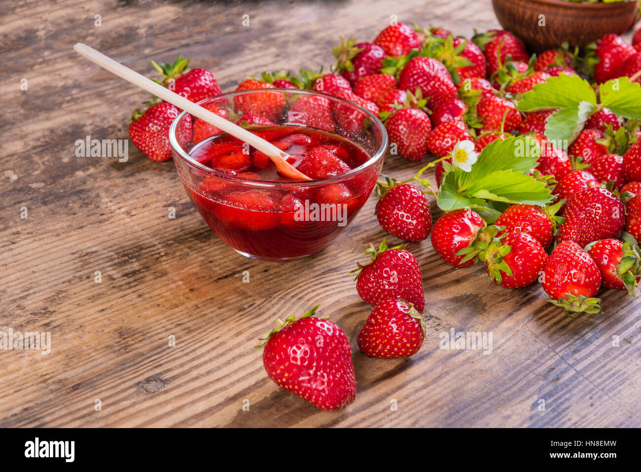 summer fresh red strawberry and jam on wood background Stock Photo - Alamy