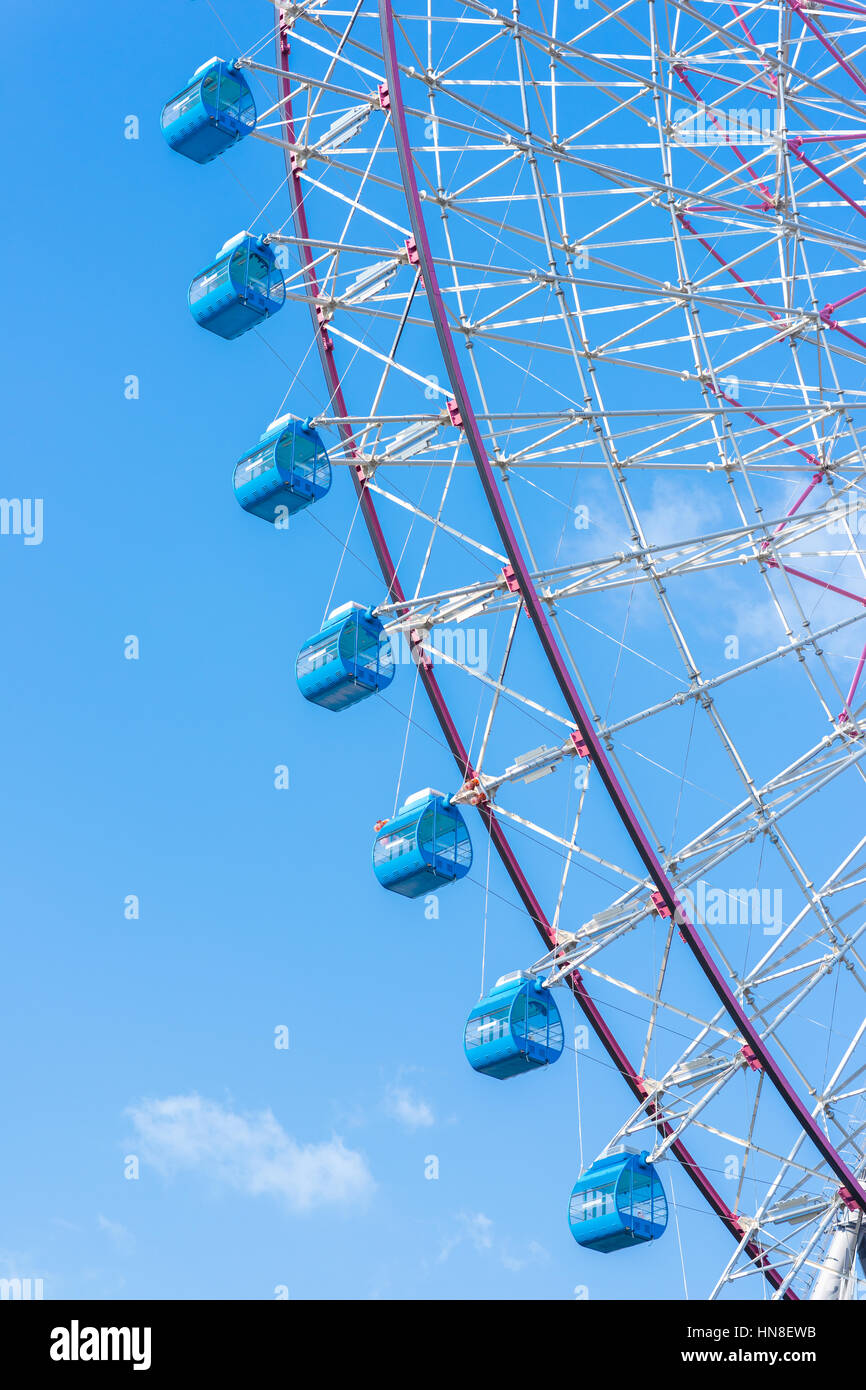 closeup ferris wheel against blue sky Stock Photo - Alamy