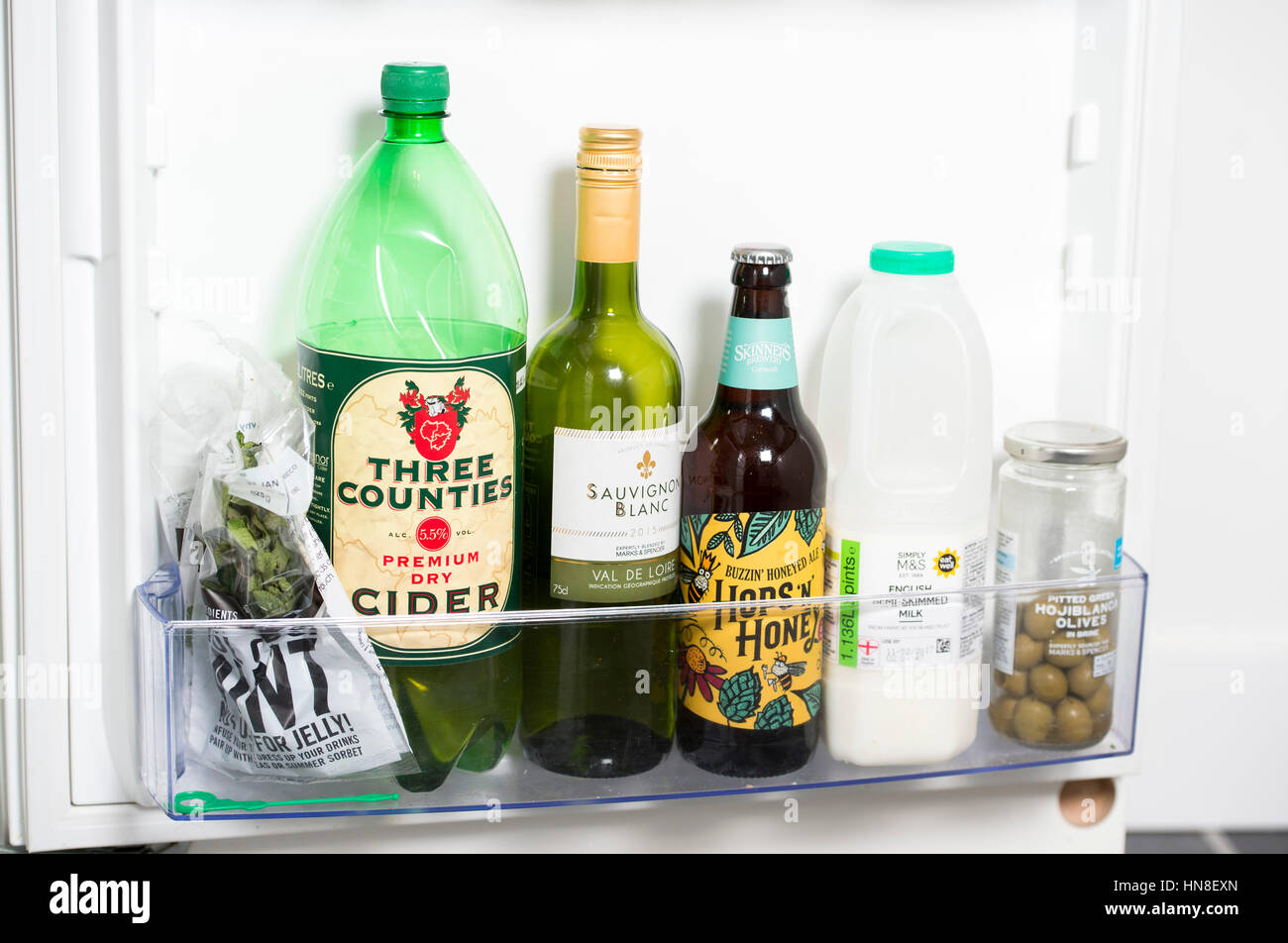 https://c8.alamy.com/comp/HN8EXN/contents-of-a-fridge-including-a-bottle-of-wine-beer-and-cider-HN8EXN.jpg