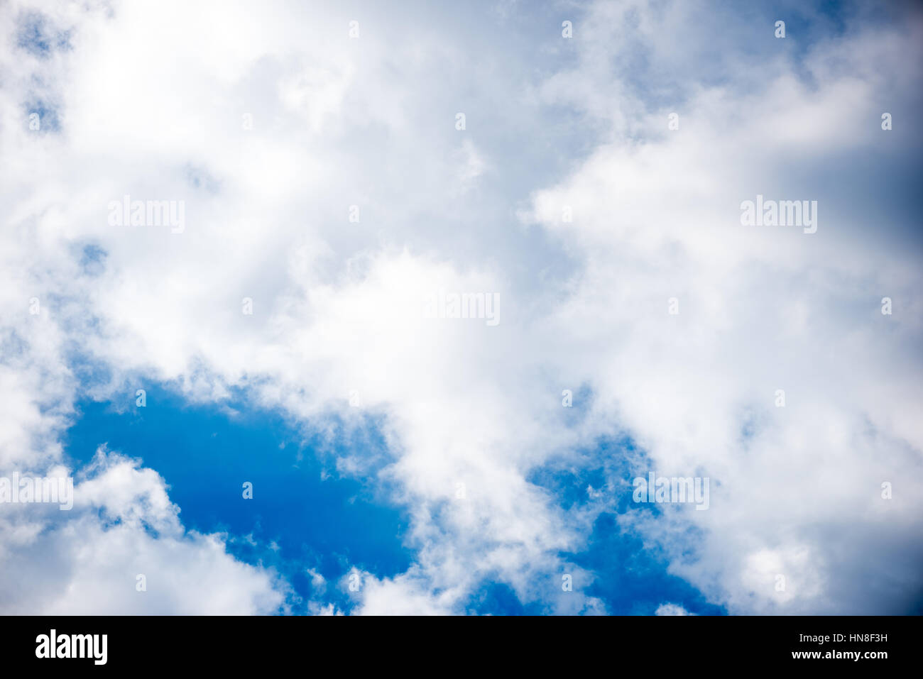 White clouds moving over sunny hi-res stock photography and images - Alamy