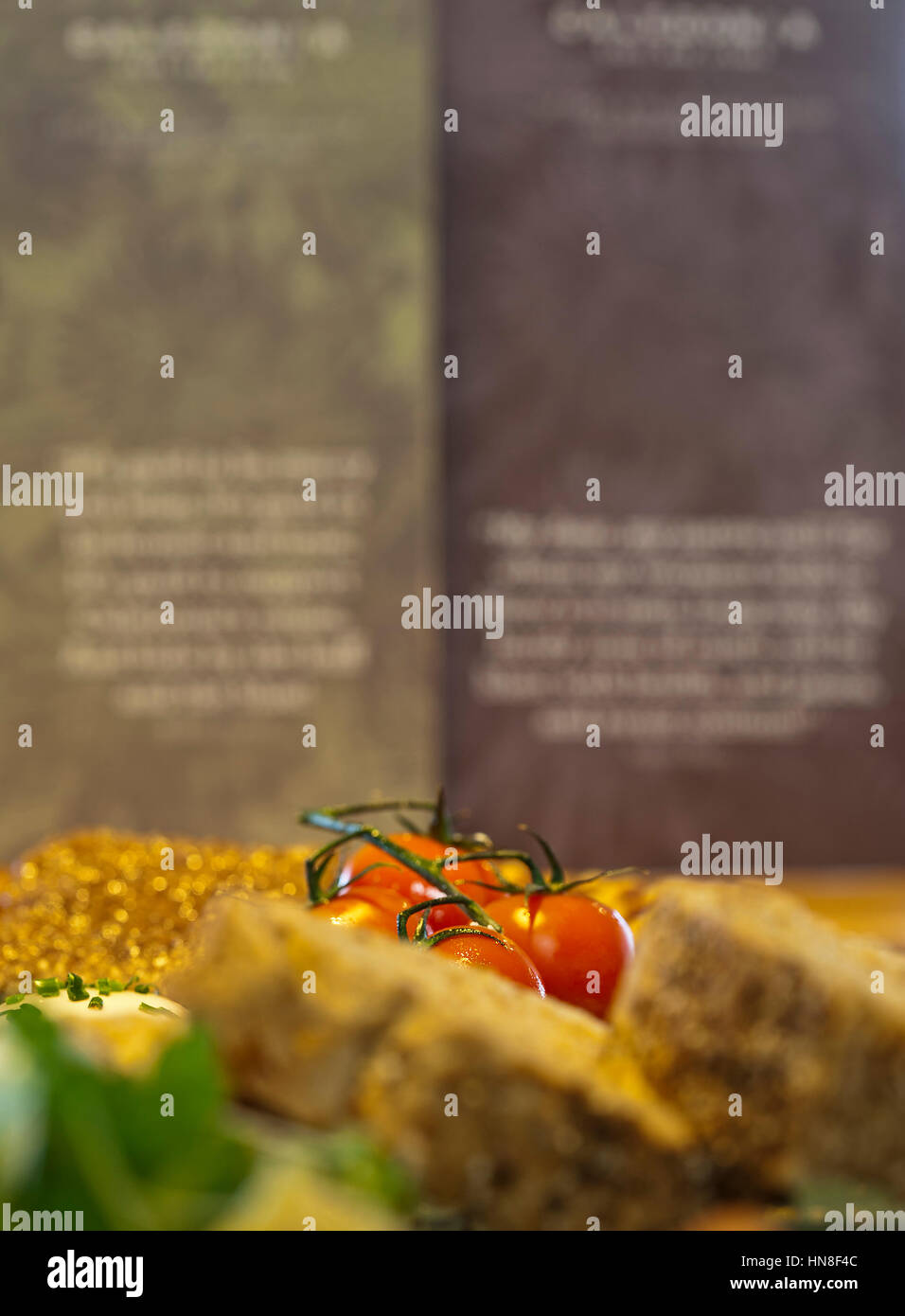 very shallow focus image of tomatoes in a meal Stock Photo