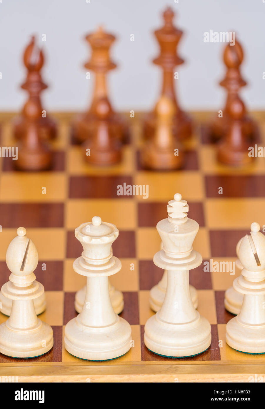 Chess pieces in starting position on a wooden oak Board Stock Photo - Alamy