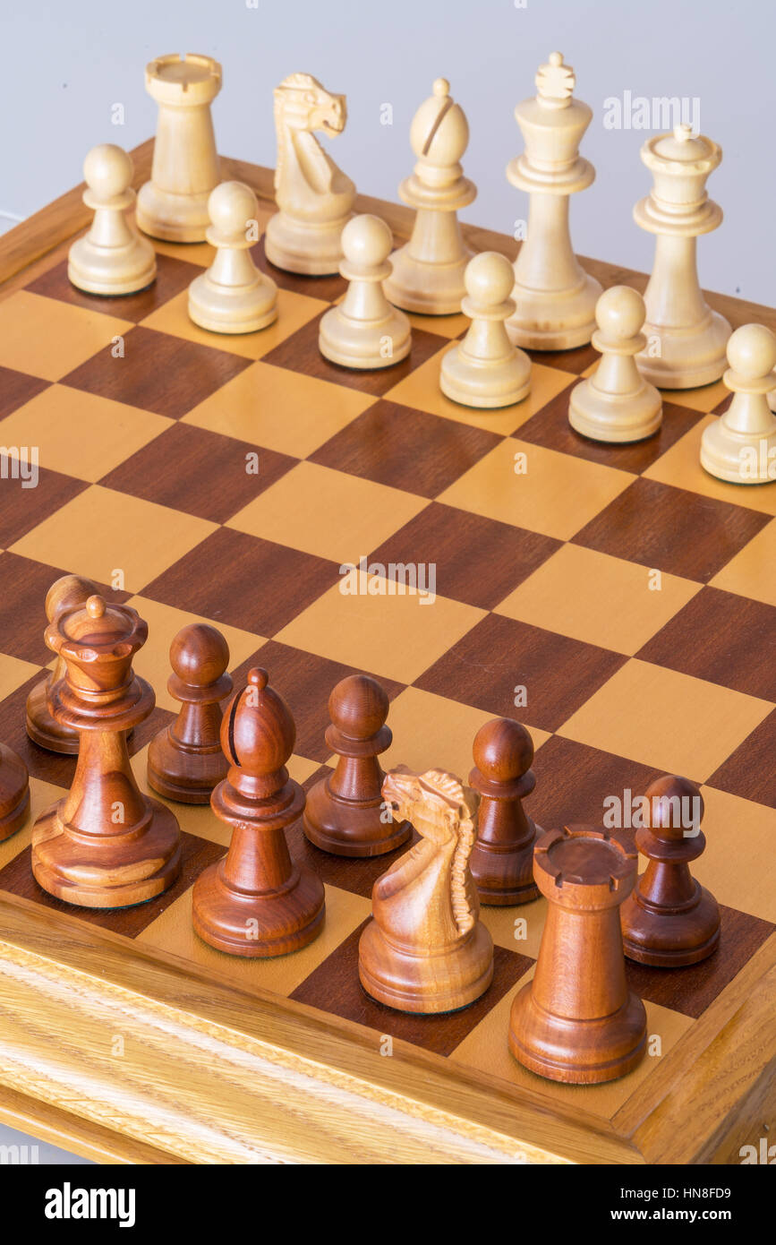 Chess pieces in starting position on a wooden oak Board Stock Photo - Alamy