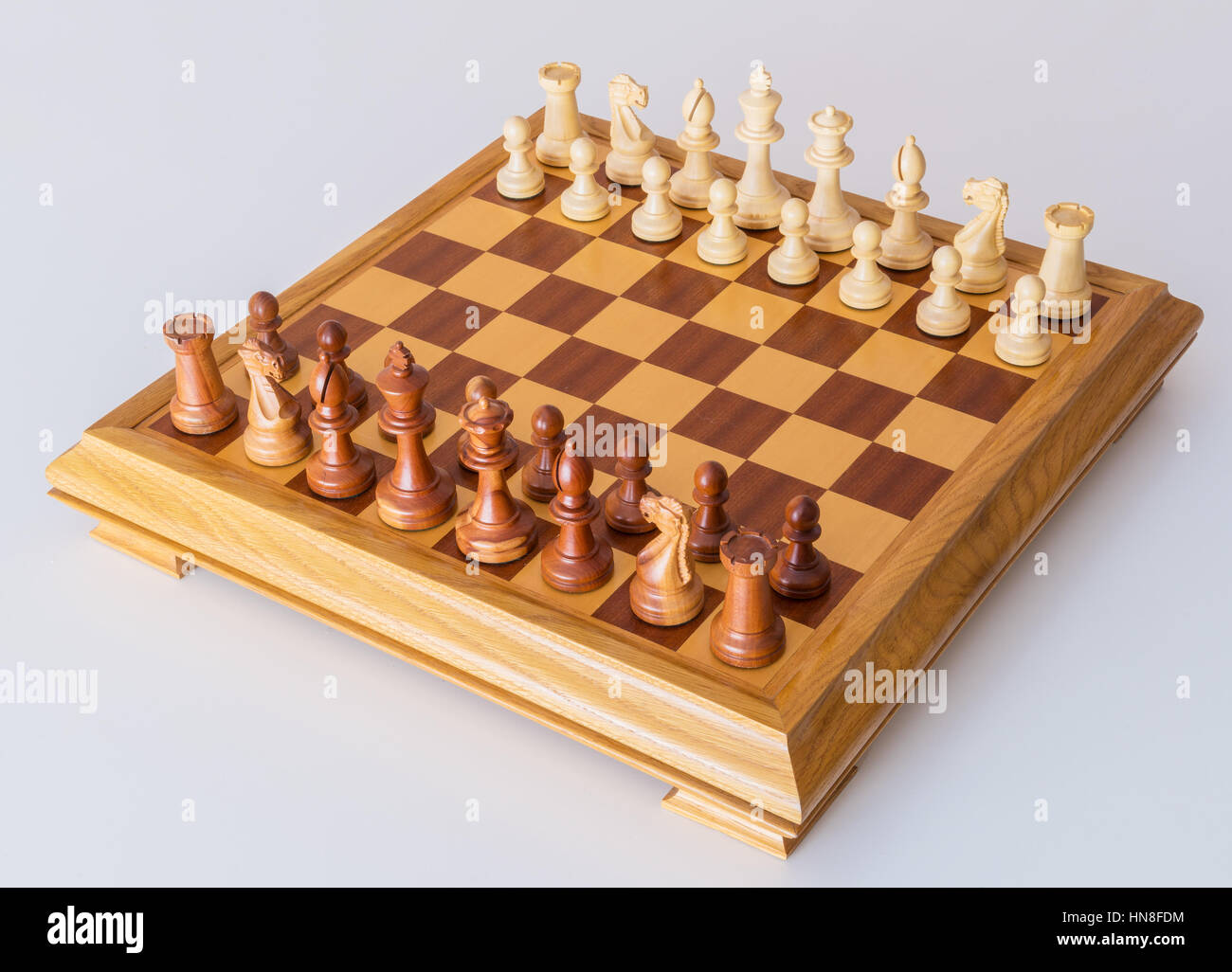 Chess pieces in starting position on a wooden oak Board Stock Photo - Alamy