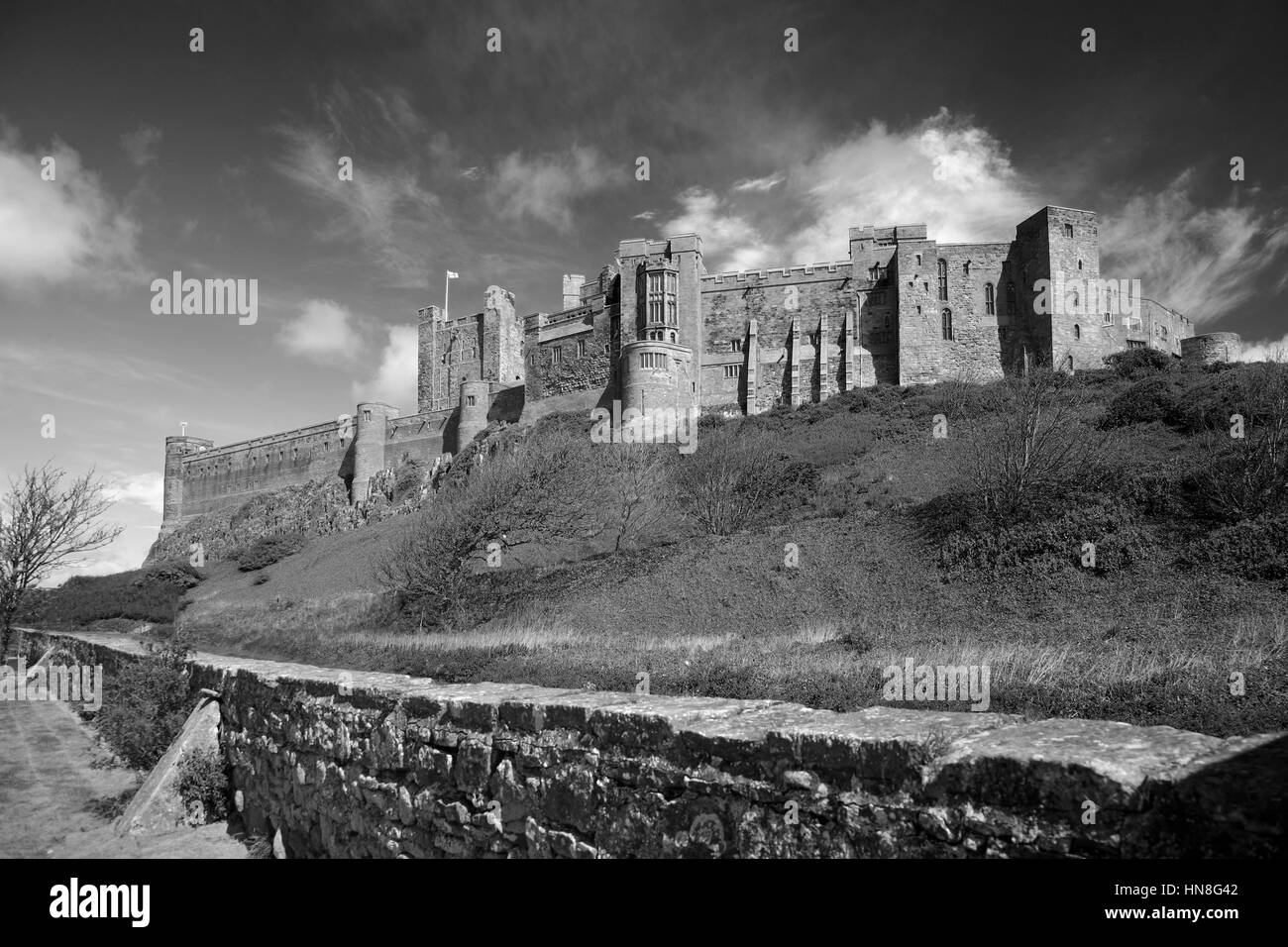 Rainbow and Storm, Bamburgh Castle, Bamburgh village, North Northumbrian Coast, Northumbria County, England, UK Stock Photo