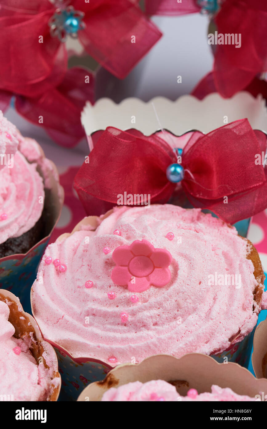 close up of cream birthday pink cup cake Stock Photo