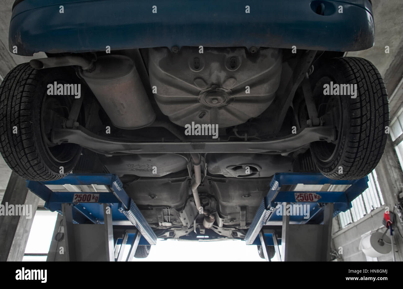 The exhaust pipe of a automobile viewed from below Stock Photo