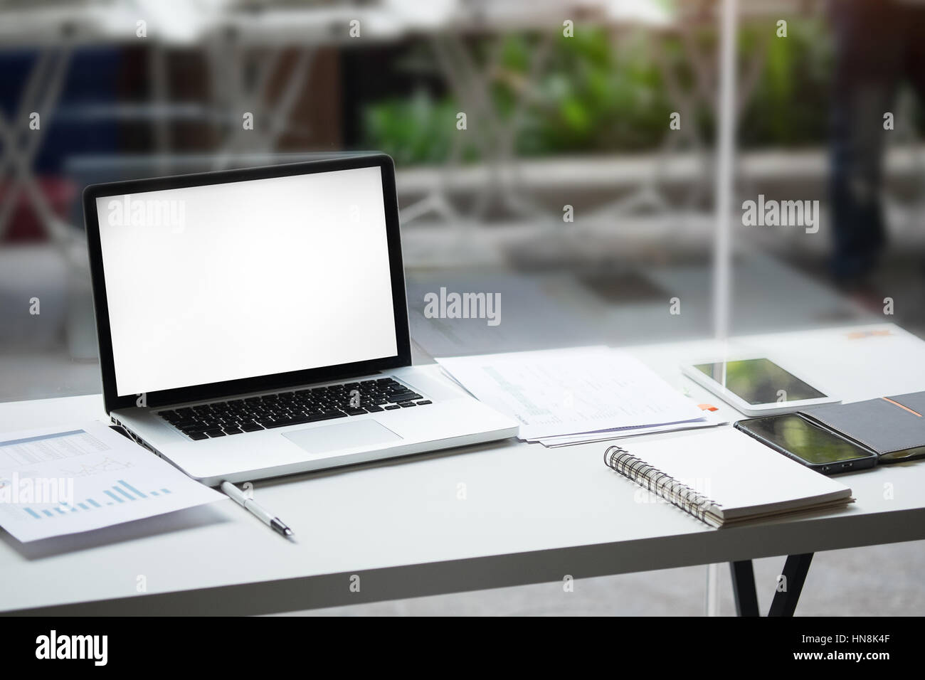 empty screen laptop and other gadget on a office table Stock Photo - Alamy