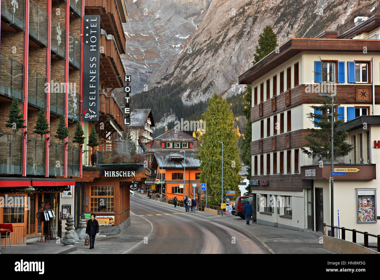 Street in Grindelwald village, in the 'shadow' of Mount Eiger (3.970 m), in the Bernese Alps, Switzerland. Stock Photo