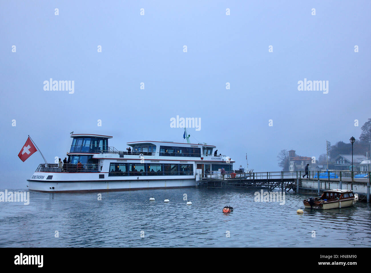 Tourist ship at Oberhofen town, Thun lake ('Thunersee'), Bernese Oberland, Switzerland. Stock Photo