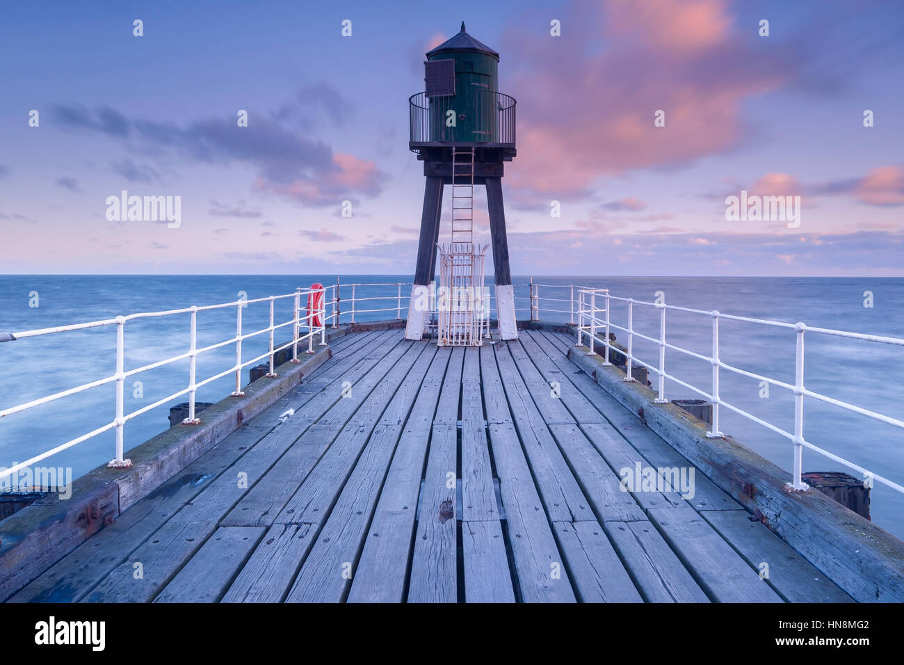 Whitby pier at sunrise, Whitby, North York Moors National Park, North Yorkshire, UK Stock Photo