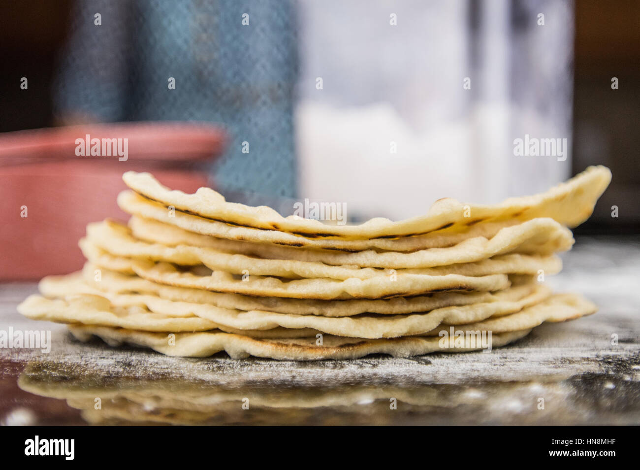 Stack of Flour Tortillas with Flour Bin and container in Background ...