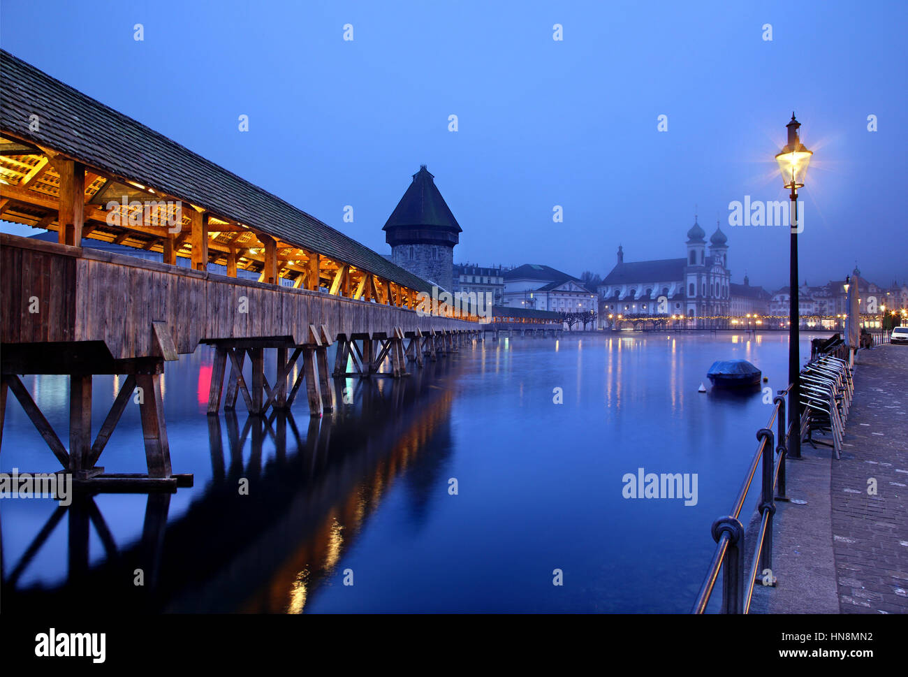 The famous Kapellbrücke ('Chapel Bridge'), a covered wooden footbridge across the Reuss River in the city of Lucern, Switzerland Stock Photo