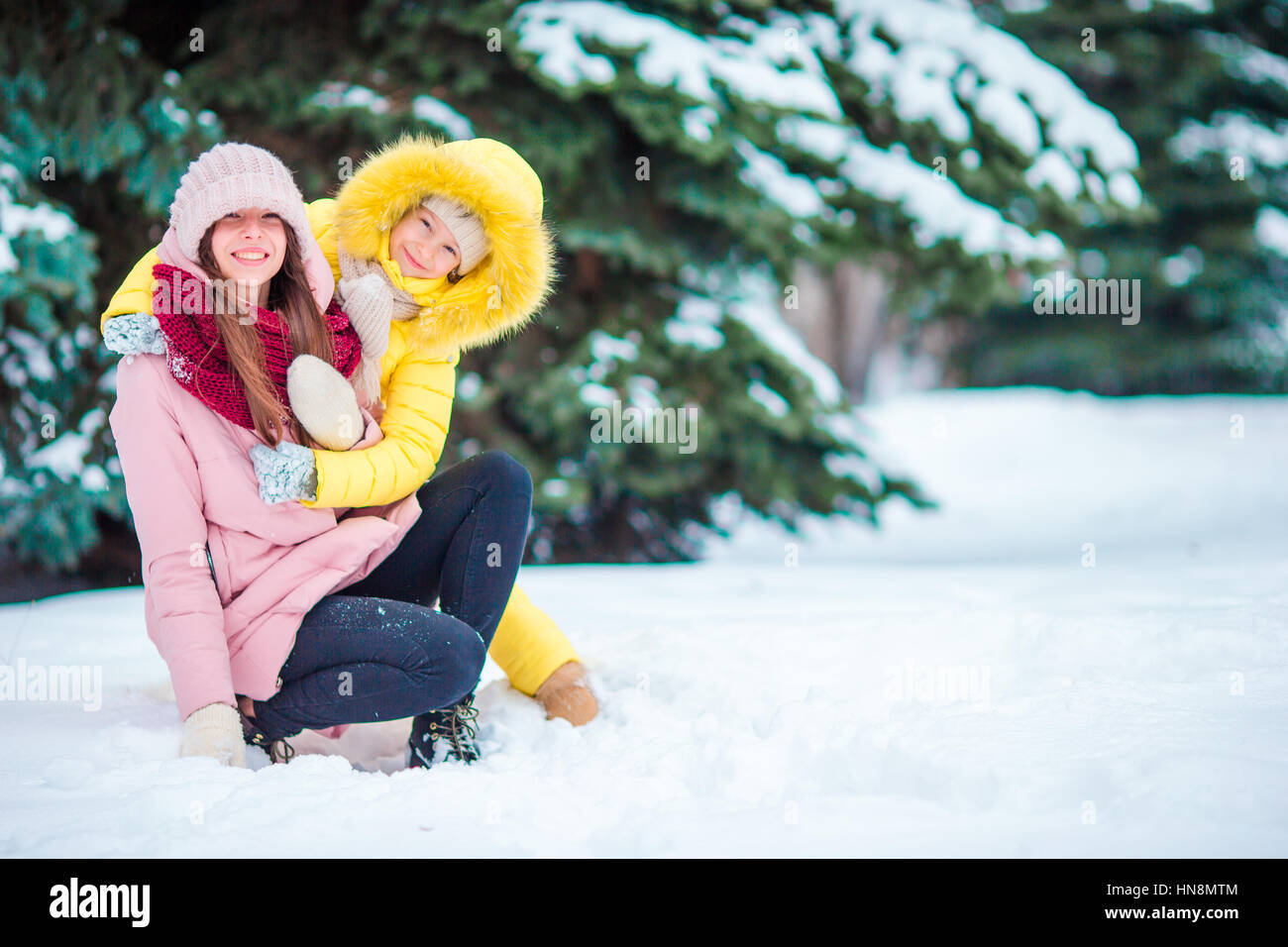 Happy mother and kid enjoy winter snowy day Stock Photo - Alamy