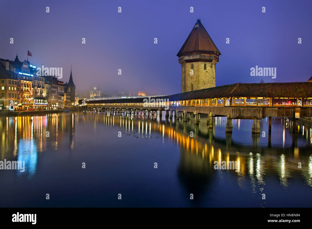 The famous Kapellbrücke ('Chapel Bridge'), a covered wooden footbridge across the Reuss River in the city of Lucern, Switzerland Stock Photo