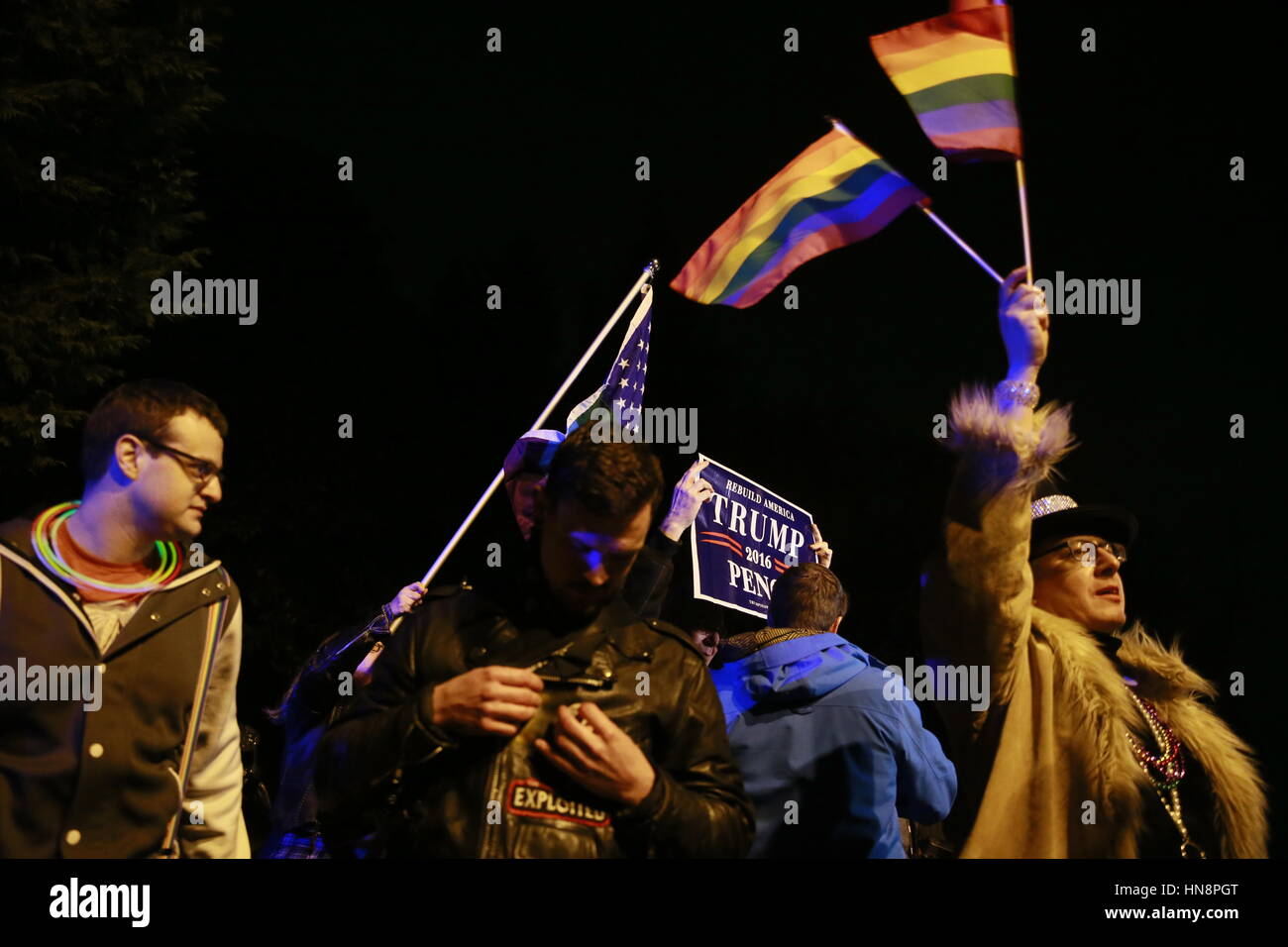 Members of the LGBTQ commuity and allies march to United States Vice President Mike Pence's new house in Chevy Chase, Maryland to protest before Donald Trump's Inauguration by having a 'queer dance party.' The protesters were met by police who had blocked the street. The protesters were upset by issues such as the religious freedom bill passed by Pence's administration as governor of Indiana that would have allowed business owners to discriminate against gays and use their religious beliefs as the reason.The bill was called RFRA. Stock Photo