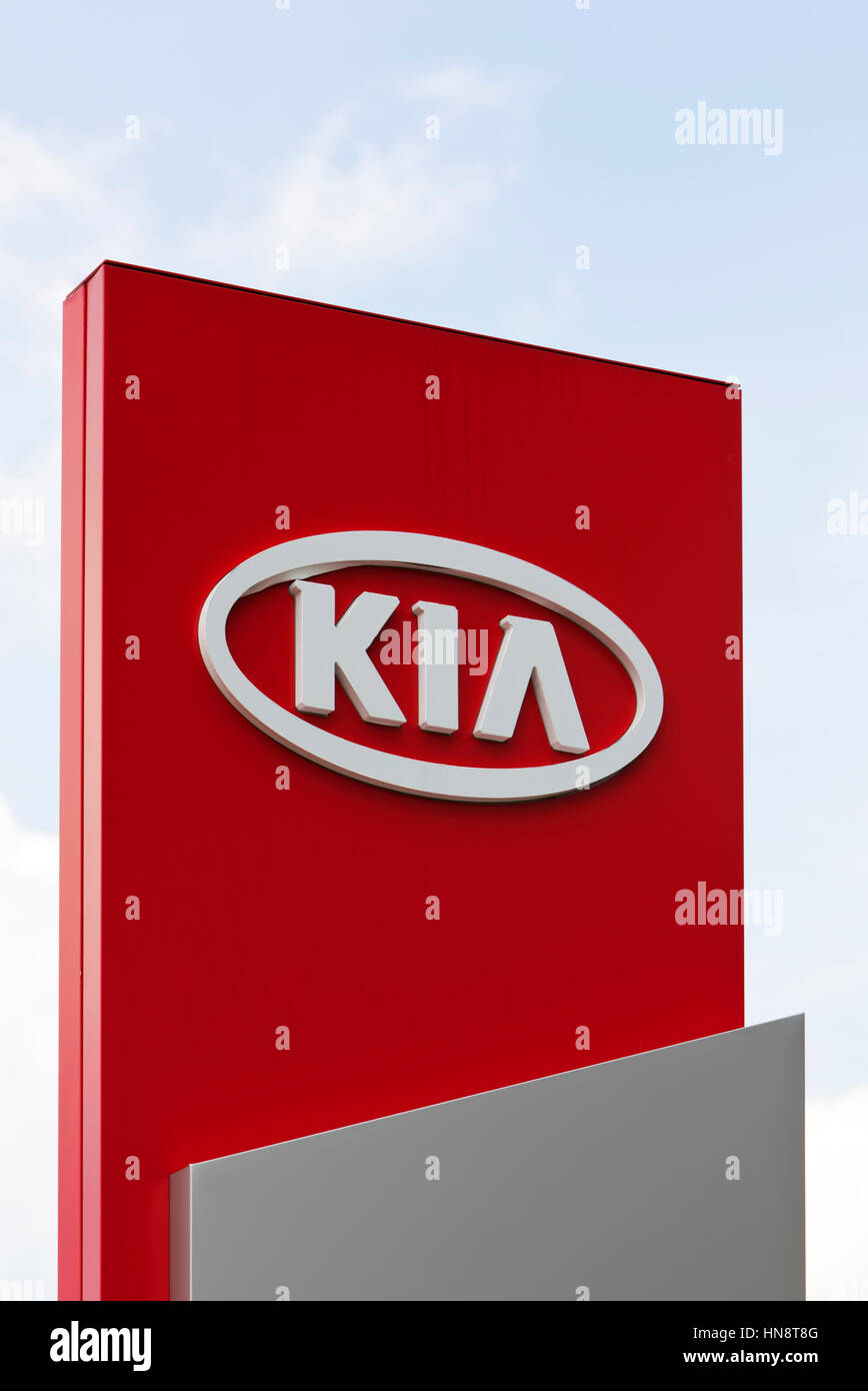 KIA logo at car dealer. KIA Motors, headquartered in Seoul, is South Korea's second largest automobile manufacturer. Stock Photo