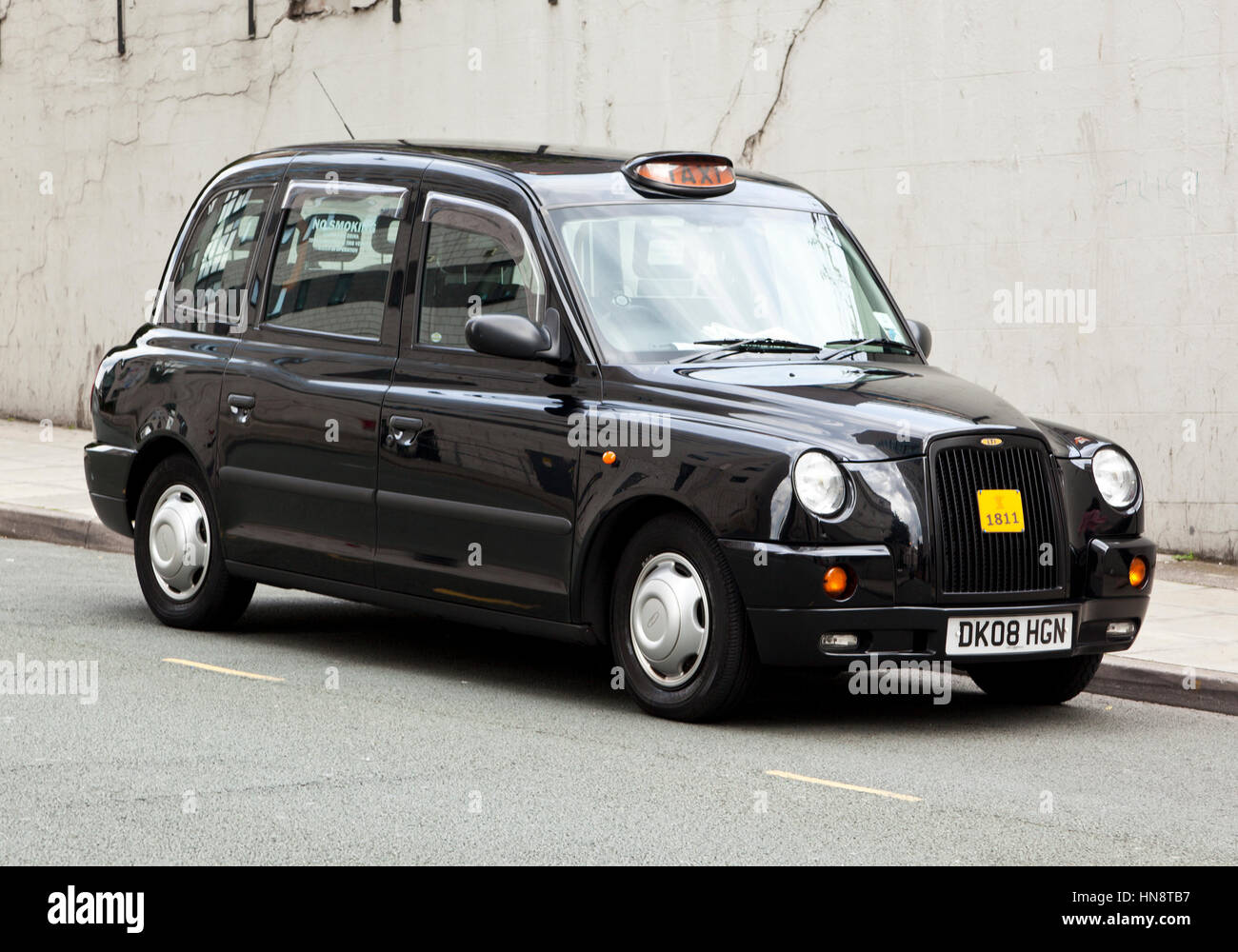 Liverpool, England - July 12, 2011: Typical british taxi cab manufactured by LTI (London Taxi International) parked in a Liverpool side street. Stock Photo