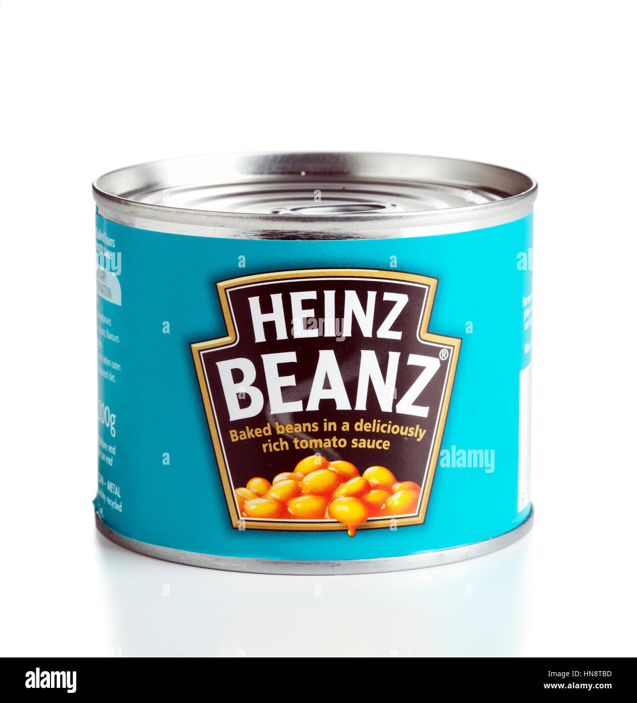 A 200 g can of Heinz Beanz baked beans in tomato sauce isolated on white background. The can was produced and purchased in the United Kingdom. Stock Photo
