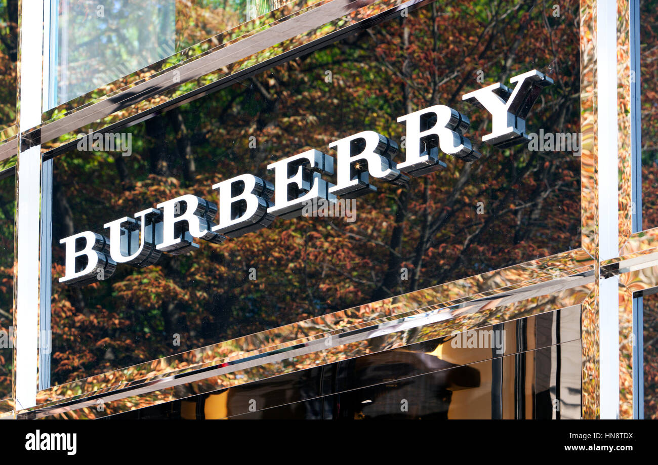 Burberry logo above store entrance on Königsallee. Burberry Group plc is a British luxury fashion house, manufacturing clothing, fragrance and fashion Stock Photo