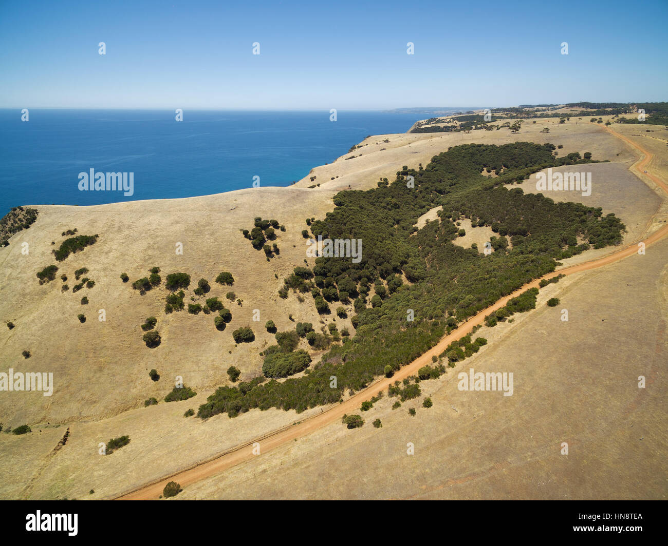 Unsealed rural road and ocean aerial view. Kangaroo Island, South Australia Stock Photo