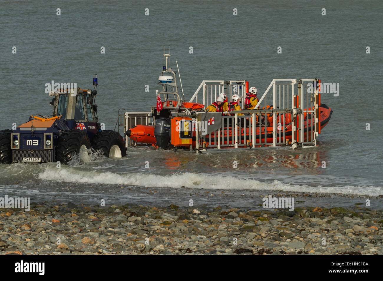 Launch Rib Cornwall RNLI Lifeboat Inshore RIB launching off Criccieth Beach North Wales UK ...