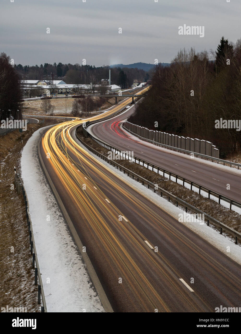 Long exposure morning motorway or highway rush hour traffic and vehicle headlights light trails  Model Release: No.  Property Release: No. Stock Photo
