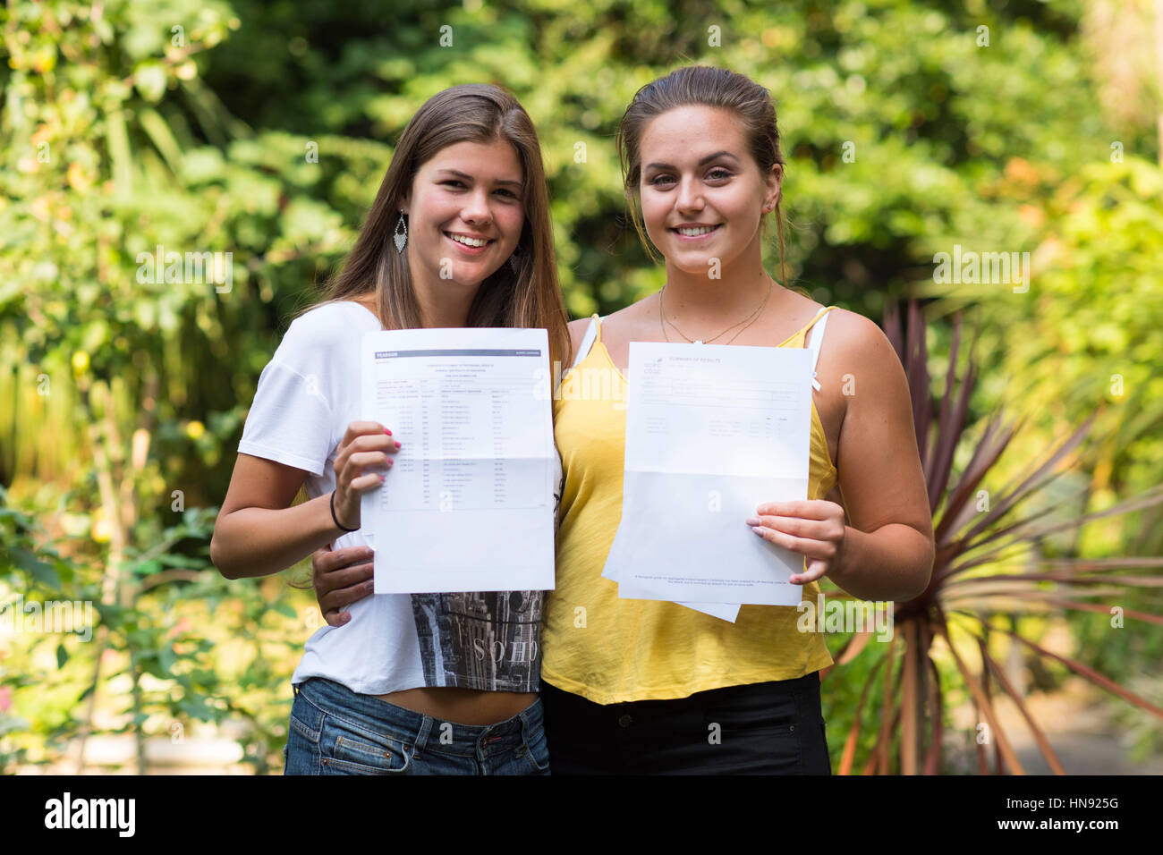 Students opening their results on A level results day in Swansea, South ...