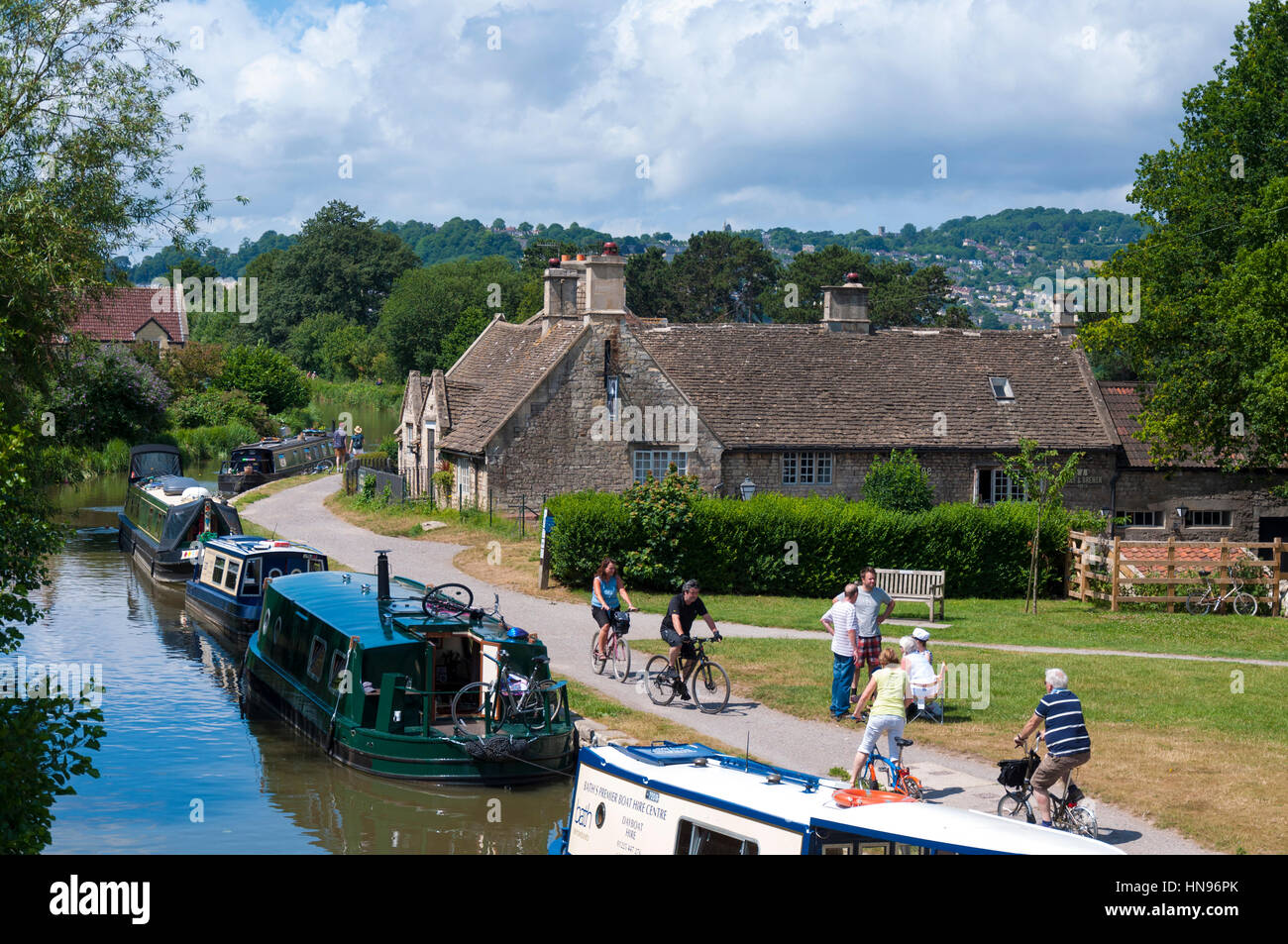 Cycling and moorings on Kennet and Avon Canal at Bathampton, Somersert, England, UK Stock Photo