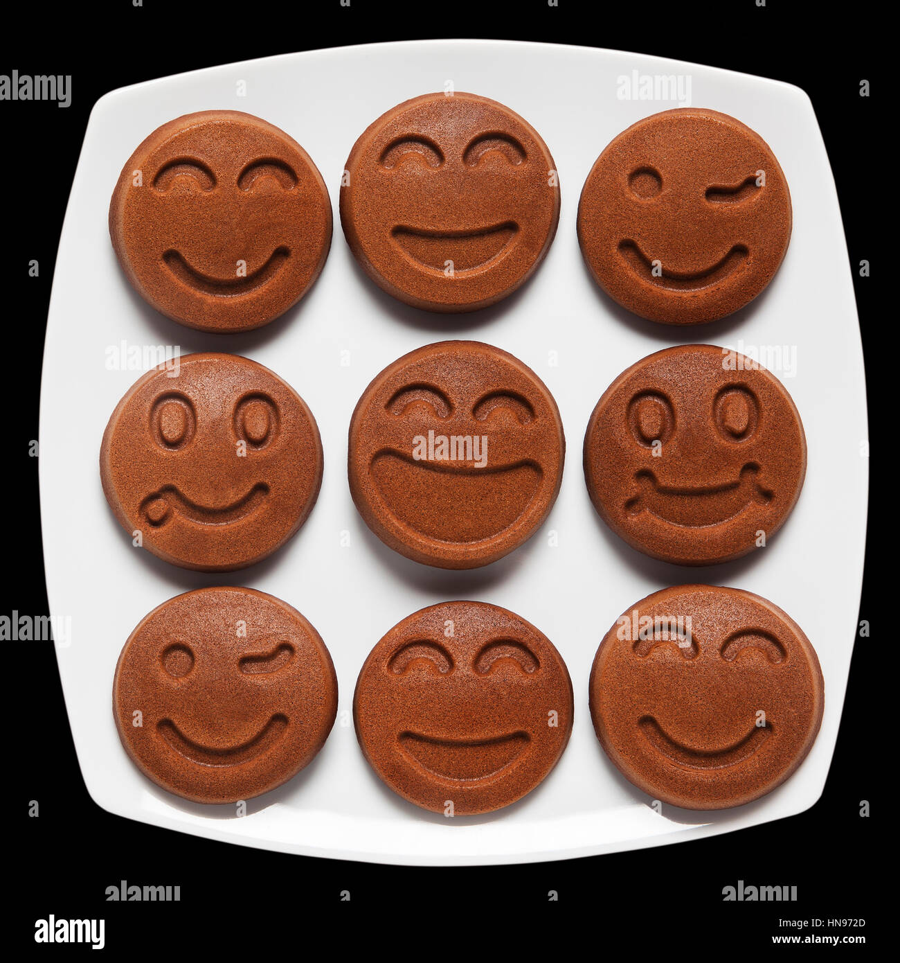 Happy Food. Smiling chocolate Pancakes. Concept of Funny Breakfast. Stock Photo