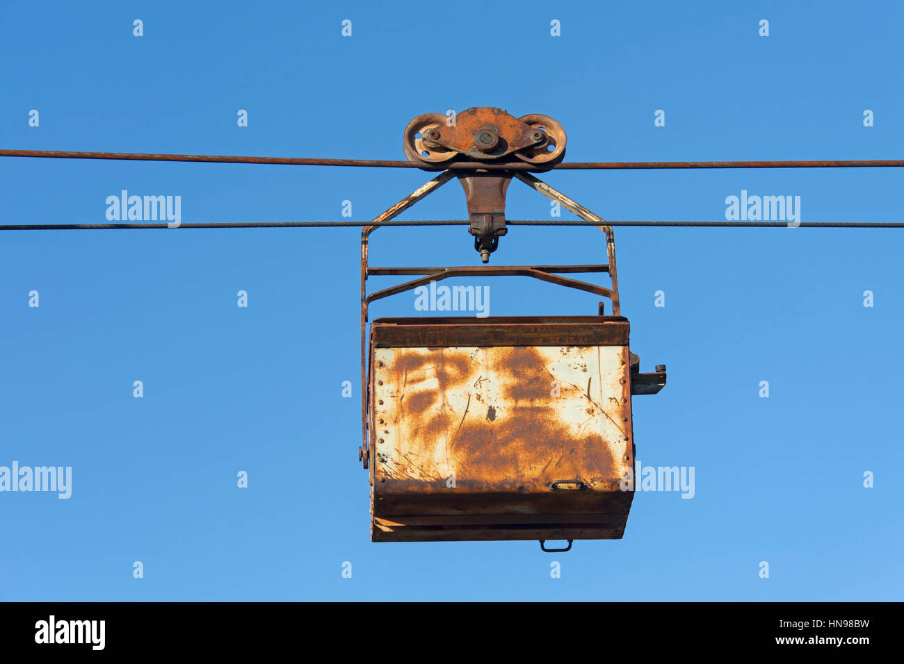 Bucket on the aerial tramway leading from the old coal mine at Longyearbyen, Svalbard, Norway Stock Photo