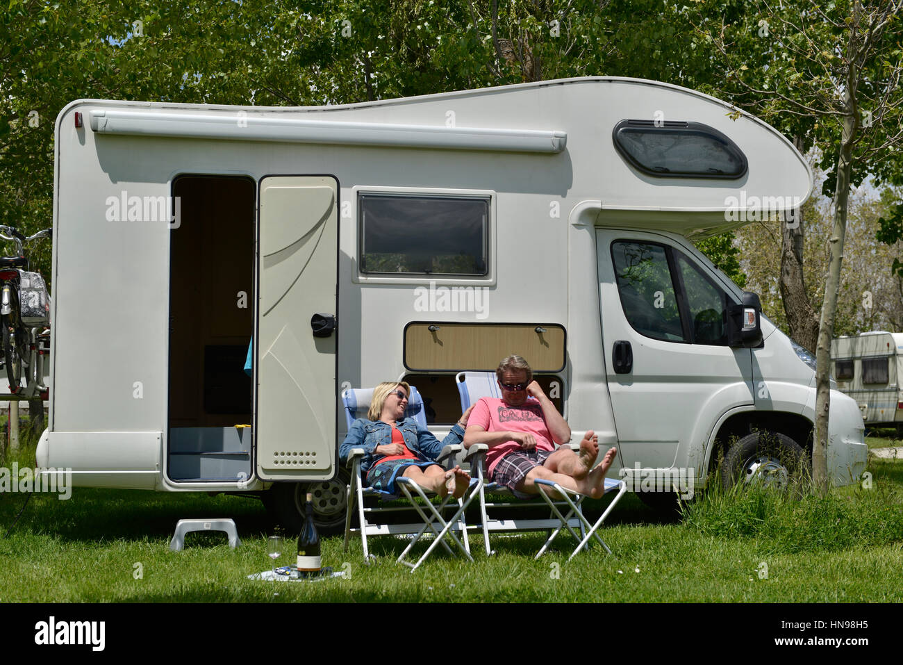 People sitting on camping chairs hi-res stock photography and images ...