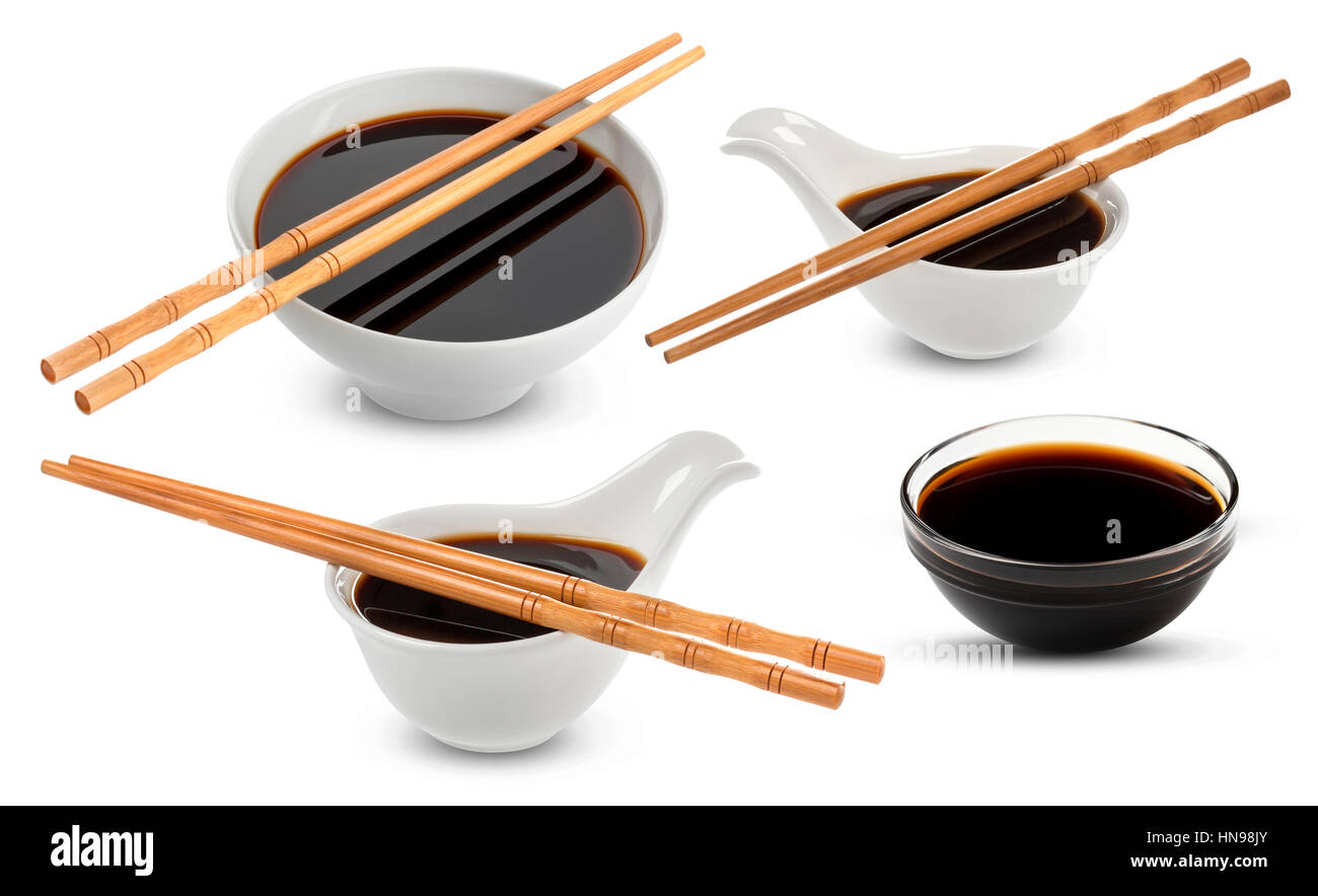 Soy sauce and chopsticks isolated on white Stock Photo