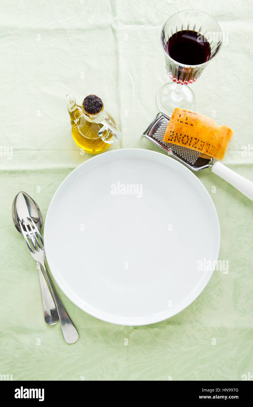 empty plates on a tablecloth in a restaurant. lunch, breakfast, dinner. Stock Photo