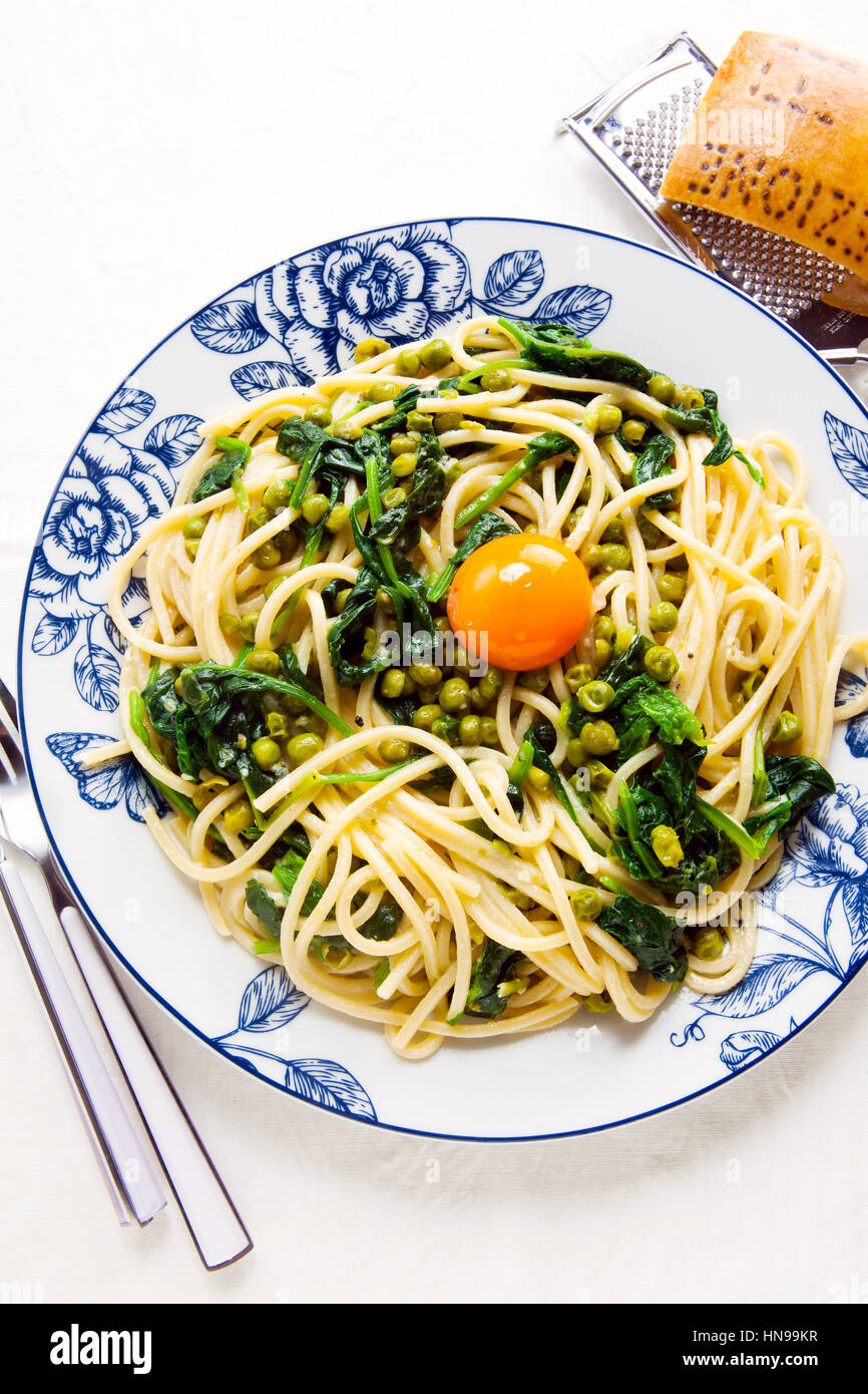 Italian pasta carbonara. vegetarian style with spinach and peas Stock Photo Alamy
