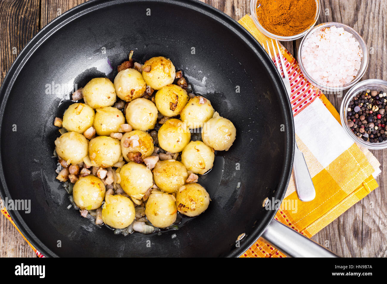 Fried potato dumplings with bacon in frying pan Stock Photo Alamy