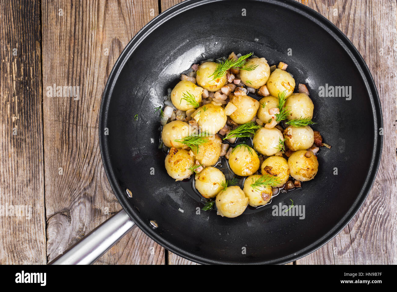 Fried potato dumplings with bacon in frying pan Stock Photo Alamy