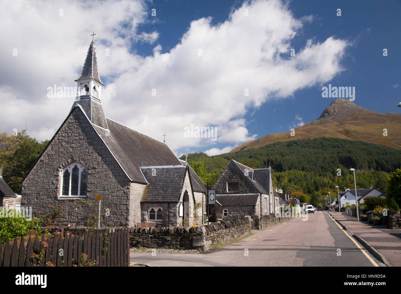 episcopal church of scotland kirk glencoe highlands scotland uk. Pap of Glen coe village at the background. Road beside. Stock Photo