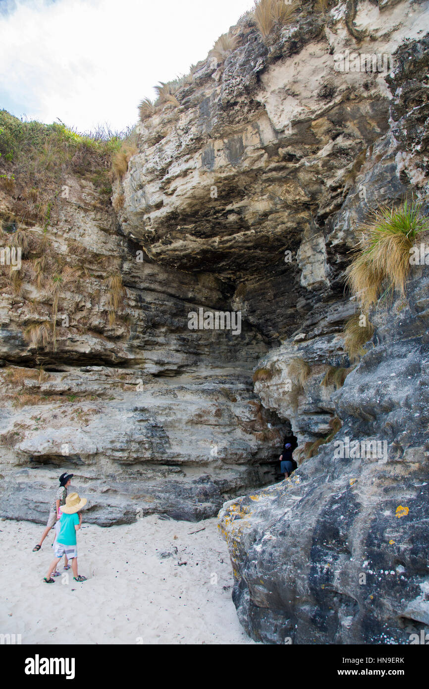 Children Walking Into Cave In The Rock At Cave Beach Booderee National children-walking-into-cave-in-the-rock-at-cave-beach-booderee-national