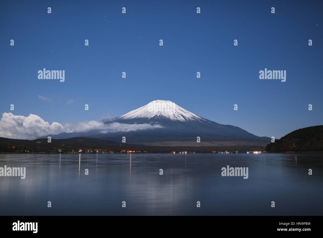 Night view of cloudy sky and Mount Fuji at night from Lake Yamanaka ...