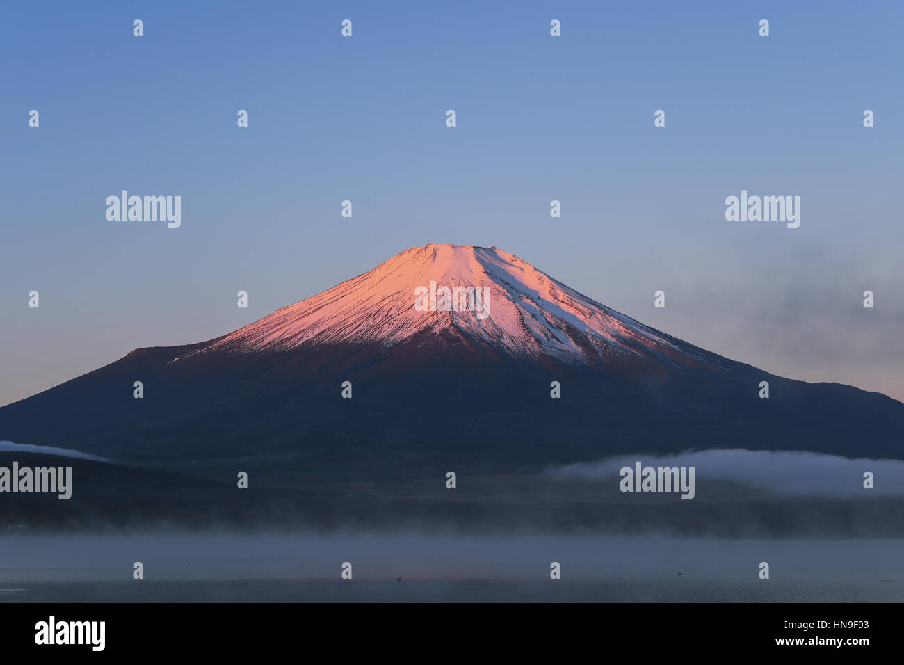 Morning light illuminating Mount Fuji at Lake Yamanaka, Yamanashi Prefecture, Japan Stock Photo