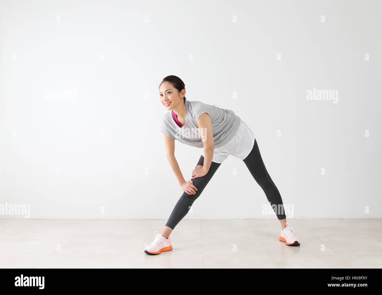 Attractive Japanese woman training in a airy room Stock Photo