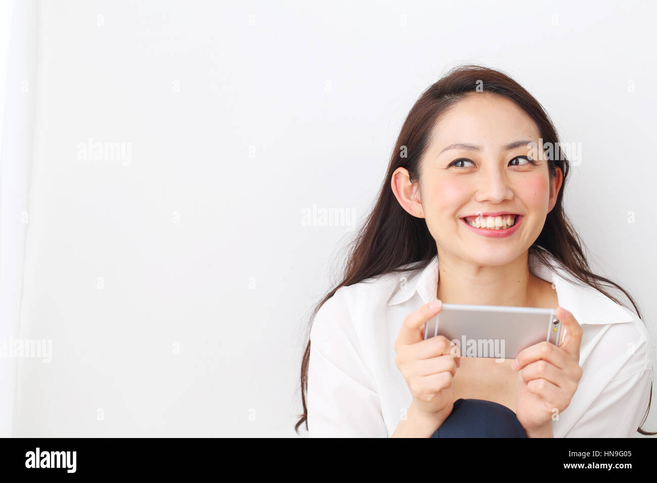 Attractive Japanese woman in a airy room Stock Photo