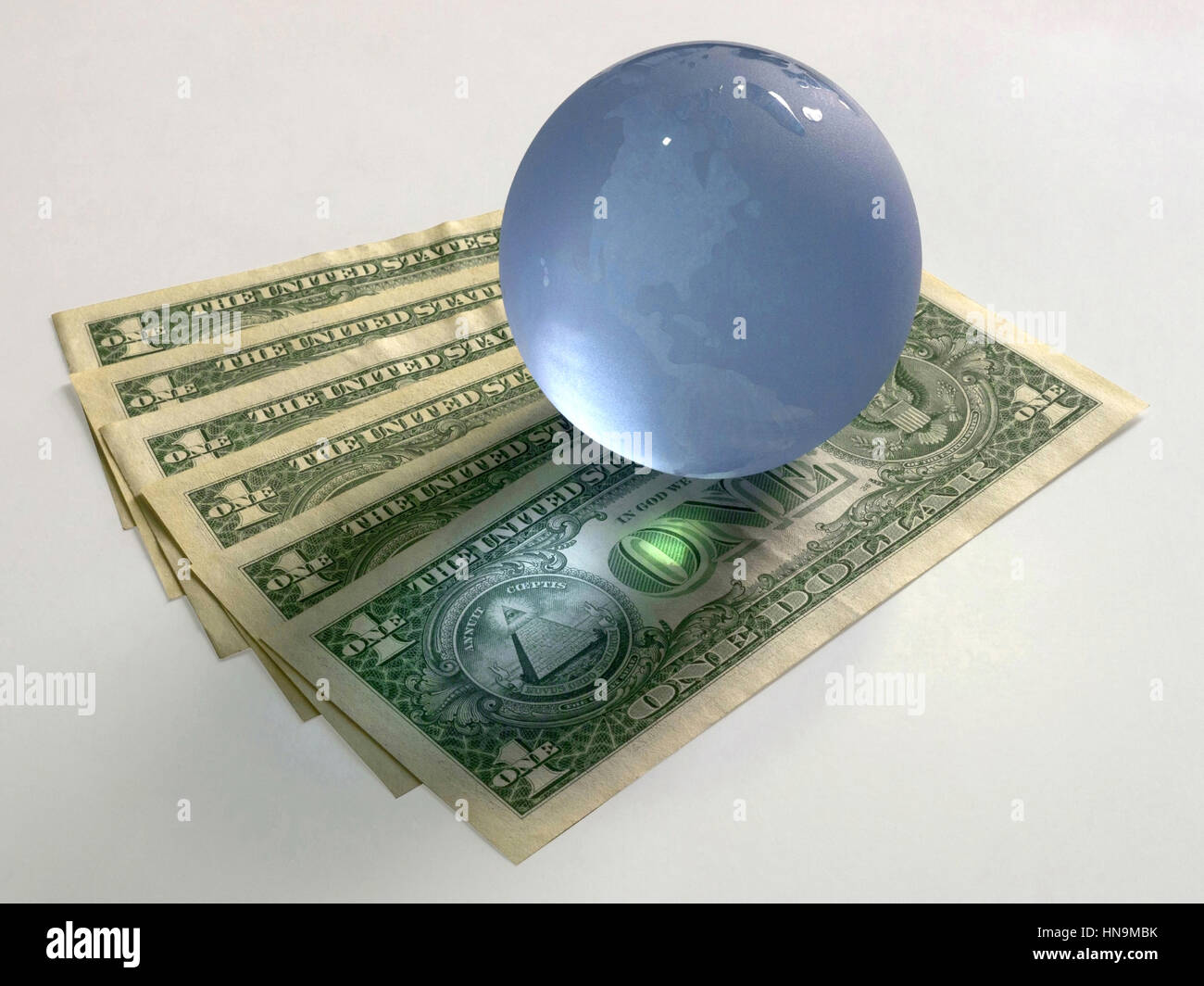 Globe with dollar notes and clipping path Stock Photo