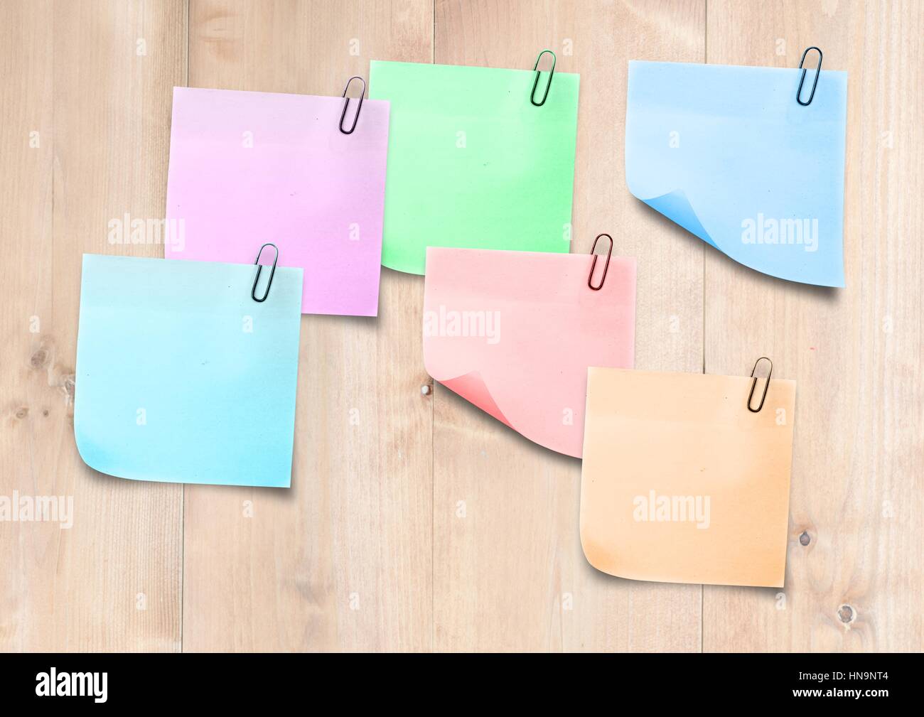 Digital composite of Sticky Note against wood panel Stock Photo - Alamy