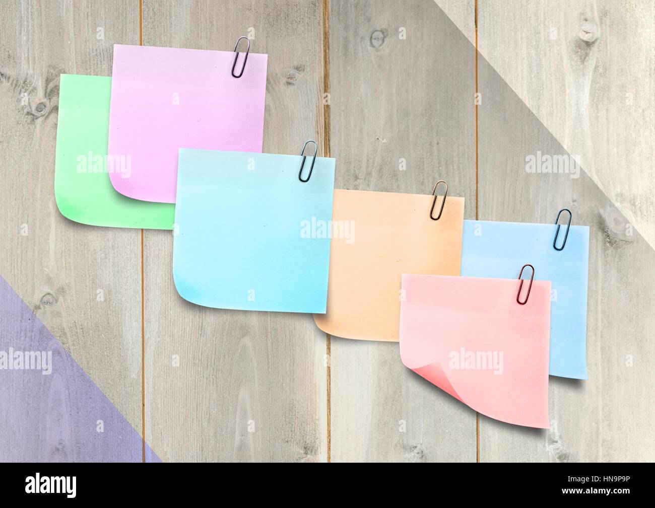 Digital composite of colored Sticky Note against wood panel Stock Photo ...